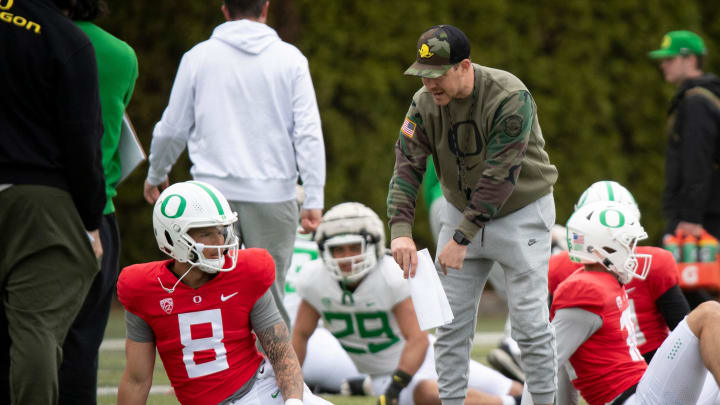Oregon offensive coordinator Will Stein talks with quarterback Dillon Gabriel during practice with the Oregon Ducks Saturday, April 6, 2024 at the Hatfield-Dowlin Complex in Eugene, Ore.