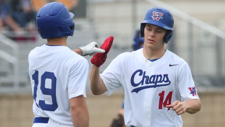 Westlake's Cole May, left, and Theo Gillen celebrate the first run scored in the Chaparrals' 17-2 win over Pflugerville Saturday in a CenTex baseball tournament matchup. Westlake begins District 26-6A play this week.