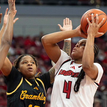 Louisville Cardinals forward Mackenly Randolph (4) goes for a jump shot against Grambling Lady Tigers defenders during their game on Thursday, Dec. 12, 2024 at the KFC Yum! Center in Louisville, Ky.