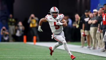 Dec 31, 2022; Atlanta, Georgia, USA; Ohio State Buckeyes running back Dallan Hayden (5) runs with