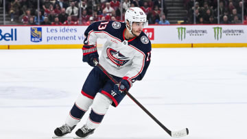 Mar 12, 2024; Montreal, Quebec, CAN; Columbus Blue Jackets left wing Johnny Gaudreau (13) plays the puck against the Montreal Canadiens during the second period at Bell Centre. Mandatory Credit: David Kirouac-USA TODAY Sports