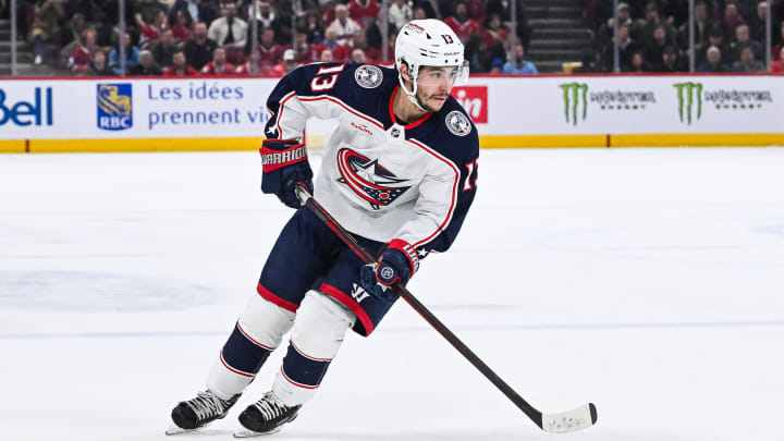 Mar 12, 2024; Montreal, Quebec, CAN; Columbus Blue Jackets left wing Johnny Gaudreau (13) plays the puck against the Montreal Canadiens during the second period at Bell Centre. Mandatory Credit: David Kirouac-USA TODAY Sports