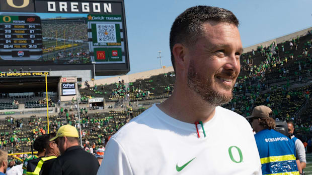 Oregon Head Coach Dan Lanning leaves the field after the win over Oklahoma State at Autzen.