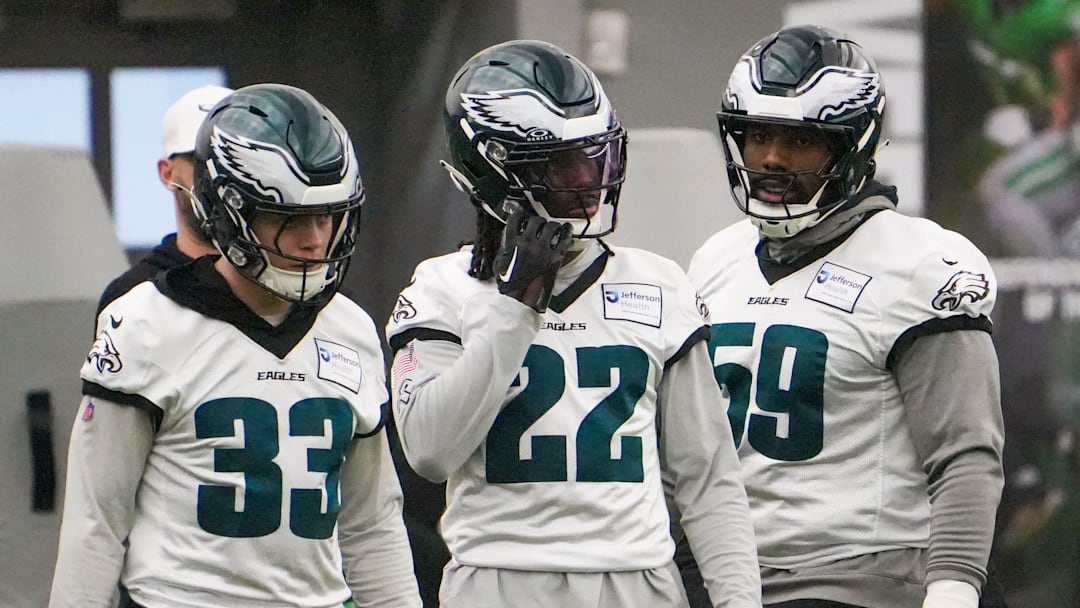 Defensive back Cooper DeJean (33) and cornerback Kelee Ringo (22) take part in warmups with defensive tackle Thomas Booker as the Philadelphia Eagles work out in preparation for the Super Bowl at the NovaCare Complex in Philadelphia on Jan. 31, 2025.