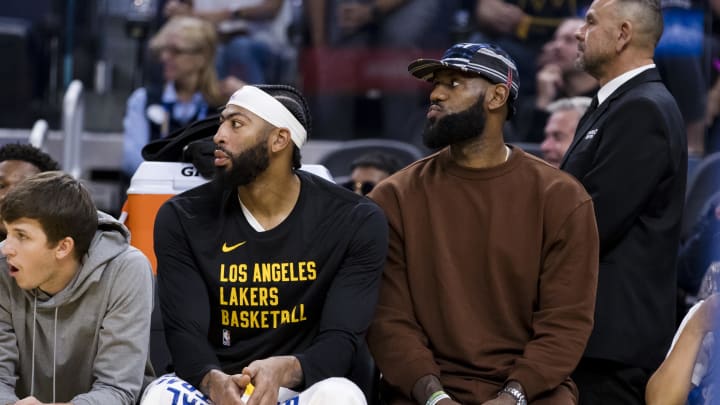 Oct 7, 2023; San Francisco, California, USA; Los Angeles Lakers forward LeBron James (23) and center Anthony Davis (3) watch the game against the Golden State Warriors during the first half at Chase Center. Mandatory Credit: John Hefti-USA TODAY Sports