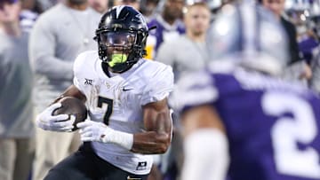 Sep 23, 2023; Manhattan, Kansas, USA; UCF Knights running back RJ Harvey (7) looks for room to run during the first quarter against the Kansas State Wildcats at Bill Snyder Family Football Stadium. 