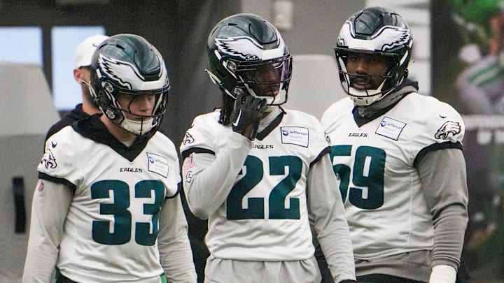 Defensive back Cooper DeJean (33) and cornerback Kelee Ringo (22) take part in warmups with defensive tackle Thomas Booker as the Philadelphia Eagles work out in preparation for the Super Bowl at the NovaCare Complex in Philadelphia on Friday, Jan. 31, 2025.