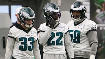 Defensive back Cooper DeJean (33) and cornerback Kelee Ringo (22) take part in warmups with defensive tackle Thomas Booker as the Philadelphia Eagles work out in preparation for the Super Bowl at the NovaCare Complex in Philadelphia on Jan. 31, 2025.