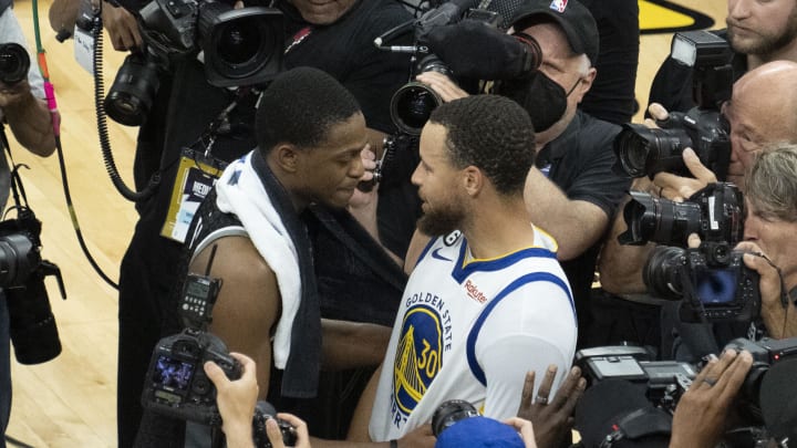 April 30, 2023; Sacramento, California, USA; Golden State Warriors guard Stephen Curry (30) hugs Sacramento Kings guard De'Aaron Fox (5) after game seven of the 2023 NBA playoffs first round at Golden 1 Center. Mandatory Credit: Kyle Terada-USA TODAY Sports