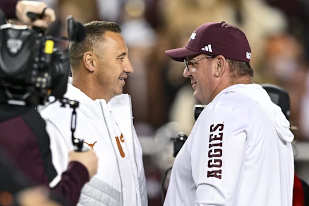 Texas Longhorns head coach Steve Sarkisian, left, and Texas A&M Aggies head coach Mike Elko, right, speak prior to the game