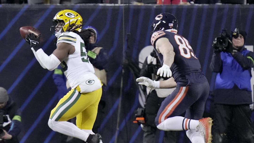 Jan 10, 2026; Chicago, IL, USA; Green Bay Packers linebacker Ty'ron Hopper (59) intercepts a pass intended for Chicago Bears tight end Cole Kmet (85) during the third quarter of an NFC Wild Card Round game at Soldier Field. Mandatory Credit: Mark Hoffman/USA TODAY Network via Imagn Images