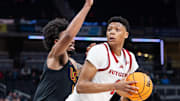 Mar 12, 2025; Indianapolis, IN, USA;  Rutgers Scarlet Knights guard Ace Bailey (4) shoots the ball while USC Trojans guard Kevin Patton Jr. (8) defends in the second half at Gainbridge Fieldhouse. Mandatory Credit: Trevor Ruszkowski-Imagn Images
