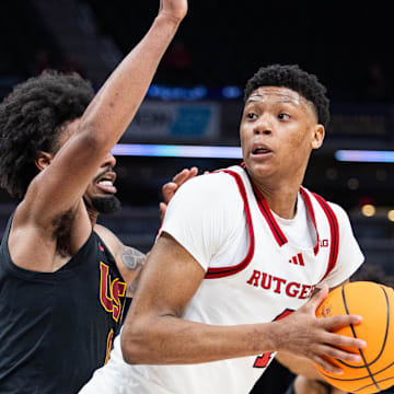 Mar 12, 2025; Indianapolis, IN, USA;  Rutgers Scarlet Knights guard Ace Bailey (4) shoots the ball while USC Trojans guard Kevin Patton Jr. (8) defends in the second half at Gainbridge Fieldhouse. Mandatory Credit: Trevor Ruszkowski-Imagn Images