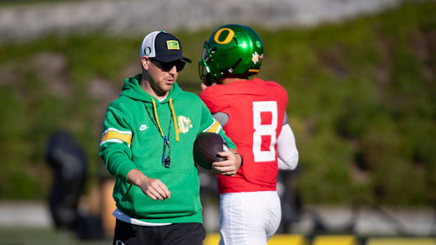 Oregon offensive coordinator coach Will Stein leads practice as the Oregon Ducks hit the practice field