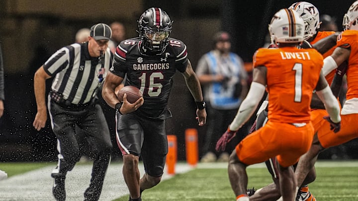 Aug 31, 2025; Atlanta, Georgia, USA; South Carolina Gamecocks quarterback LaNorris Sellers (16) runs on the sideline against the Virginia Tech Hokies during the first quarter at Mercedes-Benz Stadium. Mandatory Credit: Dale Zanine-Imagn Images