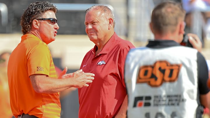 Oklahoma State Cowboys coach Mike Gundy with Arkansas Razorbacks coach Sam Pittman before game in Stillwater, Okla.