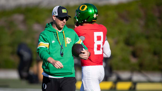 Oregon inside linebackers coach Will Stein leads practice as the Oregon Ducks hit the practice field ahead of Michigan State 