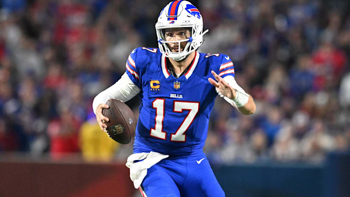 Sep 18, 2025; Orchard Park, New York, USA; Buffalo Bills quarterback Josh Allen (17) runs against the Miami Dolphins in the second half at Highmark Stadium. 