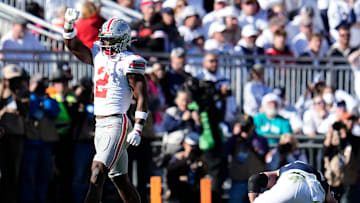 Ohio State Buckeyes safety Caleb Downs (2) celebrates a tackle of Penn State Nittany Lions tight end Tyler Warren (44) during the second half of the NCAA football game at Beaver Stadium in University Park, Pa. on Saturday, Nov. 2, 2024. Ohio State won 20-13.