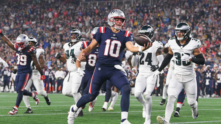 Aug 15, 2024; Foxborough, MA, USA; New England Patriots quarterback Drake Maye (10) runs the ball in for a touchdown against the Philadelphia Eagles during the first half at Gillette Stadium. Mandatory Credit: Eric Canha-USA TODAY Sports