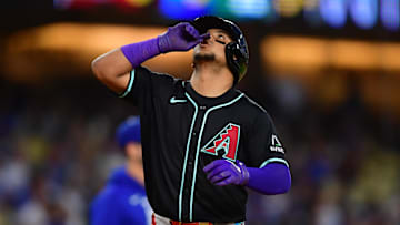 May 19, 2025; Los Angeles, California, USA;  Arizona Diamondbacks catcher Gabriel Moreno (14) celebrates after hitting a two run home run in the third inning against the Los Angeles Dodgers at Dodger Stadium. Mandatory Credit: Gary A. Vasquez-Imagn Images
