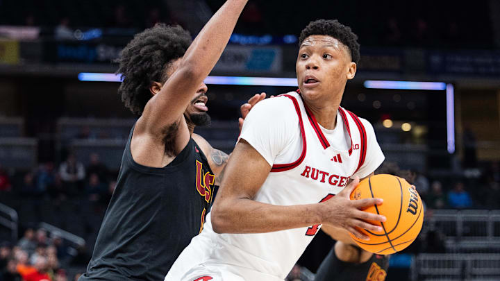 Mar 12, 2025; Indianapolis, IN, USA; Rutgers Scarlet Knights guard Ace Bailey (4) shoots the ball while USC Trojans guard Kevin Patton Jr. (8) defends in the second half at Gainbridge Fieldhouse. Mandatory Credit: Trevor Ruszkowski-Imagn Images Mar 12, 2025; Indianapolis, IN, USA; Rutgers Scarlet Knights guard Ace Bailey (4) shoots the ball while USC Trojans guard Kevin Patton Jr. (8) defends in the second half at Gainbridge Fieldhouse. Mandatory Credit: Trevor Ruszkowski-Imagn Images