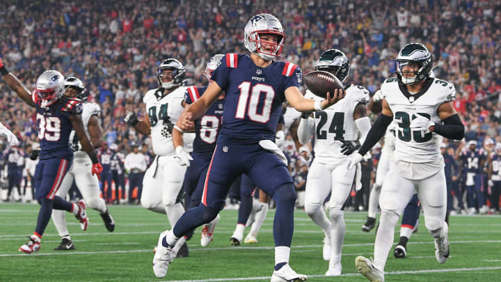 Aug 15, 2024; Foxborough, MA, USA; New England Patriots quarterback Drake Maye (10) runs the ball in for a touchdown against the Philadelphia Eagles during the first half at Gillette Stadium. Mandatory Credit: Eric Canha-USA TODAY Sports