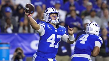 Oct 3, 2025; Provo, Utah, USA; Brigham Young Cougars quarterback Bear Bachmeier (47) throws the ball against the West Virginia Mountaineers during the second quarter at LaVell Edwards Stadium. Mandatory Credit: Rob Gray-Imagn Images