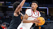 Mar 12, 2025; Indianapolis, IN, USA;  Rutgers Scarlet Knights guard Ace Bailey (4) shoots the ball while USC Trojans guard Kevin Patton Jr. (8) defends in the second half at Gainbridge Fieldhouse. Mandatory Credit: Trevor Ruszkowski-Imagn Images