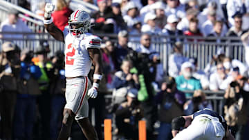 Ohio State Buckeyes safety Caleb Downs (2) celebrates a tackle of Penn State Nittany Lions tight end Tyler Warren (44) during the second half of the NCAA football game at Beaver Stadium in University Park, Pa. on Saturday, Nov. 2, 2024. Ohio State won 20-13.