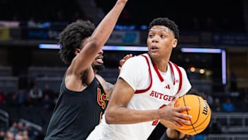 Mar 12, 2025; Indianapolis, IN, USA;  Rutgers Scarlet Knights guard Ace Bailey (4) shoots the ball while USC Trojans guard Kevin Patton Jr. (8) defends in the second half at Gainbridge Fieldhouse. Mandatory Credit: Trevor Ruszkowski-Imagn Images