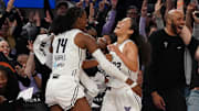 May 21, 2025; San Francisco, California, USA;  Golden State Valkyries center Temi Fagbenle (14) congratulates guard Veronica Burton (22) after Burton made a three point basket at the buzzer against the Washington Mystics in the second quarter at Chase Center. Mandatory Credit: David Gonzales-Imagn Images