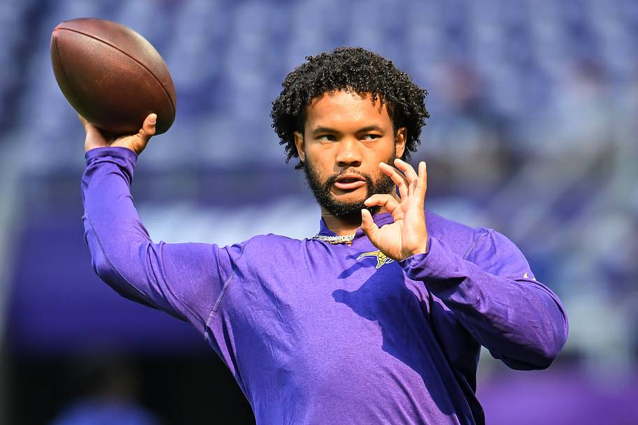 Kyler Murray throws a warm-up pass with no helmet on.