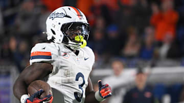 Nov 15, 2025; Durham, North Carolina, USA;  Virginia Cavaliers running back J'Mari Taylor (3) scores a touchdown against the Duke Blue Devils during the third quarter at Wallace Wade Stadium. Mandatory Credit: Zachary Taft-Imagn Images