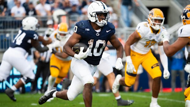 Penn State running back Nick Singleton (10) carries the ball in the second half of an NCAA football game against Kent State, 