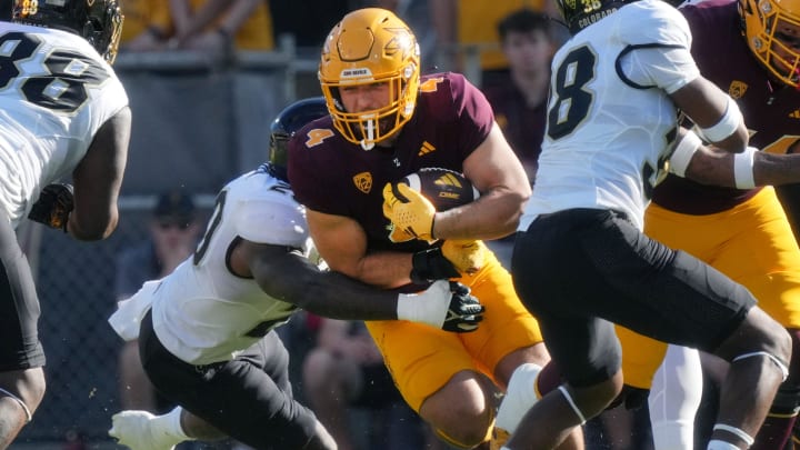 Oct 7, 2023; Tempe, Arizona, USA; ASU Sun Devils running back Cam Skattebo (4) carries the ball through the defensive line.