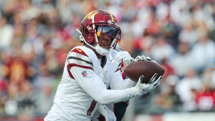 Nov 5, 2023; Foxborough, Massachusetts, USA; Washington Commanders receiver Jahan Dotson (1) catches a pass for a touchdown during the second half against the New England Patriots at Gillette Stadium. Mandatory Credit: Paul Rutherford-USA TODAY Sports