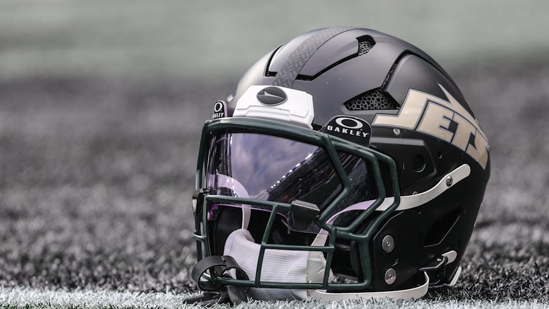 Dec 7, 2025; East Rutherford, New Jersey, USA; A general view of a Gotham City football rivalries helmet resting on the field before the game against the Miami Dolphins at MetLife Stadium. Mandatory Credit: Vincent Carchietta-Imagn Images