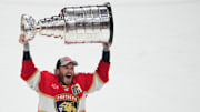 Florida Panthers forward Matthew Tkachuk hoists the Stanley Cup after defeating Edmonton Oilers in game seven