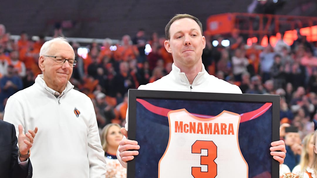 Mar 4, 2023; Syracuse, New York, USA; Syracuse Orange  former player Gerry McNamara holds his framed jersey during a ceremony to retire his number at JMA Wireless Dome. Mandatory Credit: Mark Konezny-Imagn Images