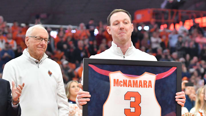 Mar 4, 2023; Syracuse, New York, USA; Syracuse Orange  former player Gerry McNamara holds his framed jersey during a ceremony to retire his number at JMA Wireless Dome. Mandatory Credit: Mark Konezny-Imagn Images