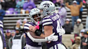Kansas State Wildcats running back Joe Jackson is congratulated by Kansas State Wildcats defensive end Cody Stufflebean after scoring a touchdown. Mandatory Credit: Scott Sewell-Imagn Images