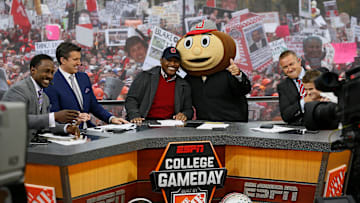 Lee Corso gives the thumbs up after picking Ohio State to win while, from left, Desmond Howard, Rece Davis, Archie Griffin, and Kirk Herbstreit sit on the set of ESPN's College GameDay broadcast from the campus of Ohio State prior to the NCAA football game against the Michigan State Spartans in Columbus on Nov. 21, 2015. (Adam Cairns / The Columbus Dispatch)