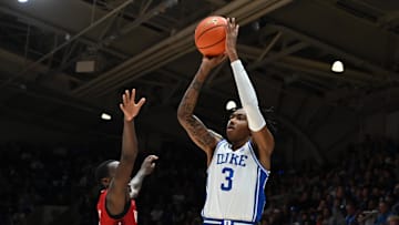 Dec 10, 2024; Durham, North Carolina, USA;  Duke basketball forward Isaiah Evans (3) shoots over Incarnate Word Cardinals guard Davion Bailey (5) during the second half at Cameron Indoor Stadium. Mandatory Credit: Rob Kinnan-Imagn Images