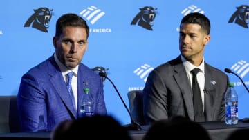 Feb 1, 2024; Charlotte, NC, USA; Carolina Panthers general manager Dan Morgan (left) speaks with new coach Dave Canales during the introductory press conference at Bank of America Stadium. Mandatory Credit: Jim Dedmon-USA TODAY Sports