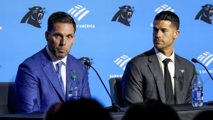 Feb 1, 2024; Charlotte, NC, USA; Carolina Panthers general manager Dan Morgan (left) speaks with new coach Dave Canales during the introductory press conference at Bank of America Stadium. Mandatory Credit: Jim Dedmon-USA TODAY Sports