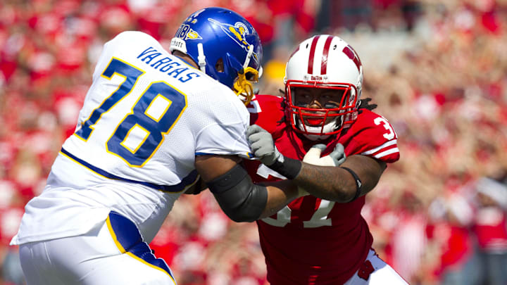 Sep 11, 2010; Madison, WI, USA; Wisconsin Badgers linebacker Kevin Claxton (right) is blocked by San Jose State Spartans offensive tackle Andres Vargas (78) during the game at Camp Randall Stadium.  The Wisconsin Badgers defeated the San Jose State Spartans 27-14.  Mandatory Credit: Jeff Hanisch-Imagn Images