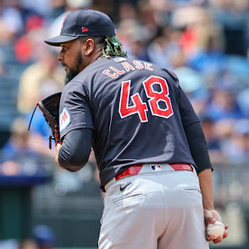 Jun 30, 2024; Kansas City, Missouri, USA; Cleveland Guardians pitcher Emmanuel Clase (48) prepares to throw a pitch during the eighth inning against the Kansas City Royals at Kauffman Stadium. Mandatory Credit: William Purnell-Imagn Images