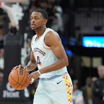 Mar 12, 2025; San Antonio, Texas, USA; San Antonio Spurs guard De'Aaron Fox (4) dribbles up the court in the first half against the Dallas Mavericks at Frost Bank Center. Mandatory Credit: Daniel Dunn-Imagn Images