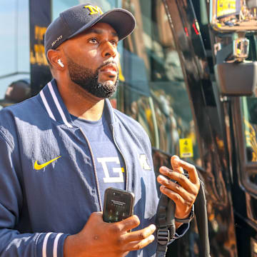 Michigan football head coach Sherrone Moore, players honor the memory of athletic counselor Greg Harden with t-shirts, hats and helmet decals for Saturday's game vs. Arkansas State.